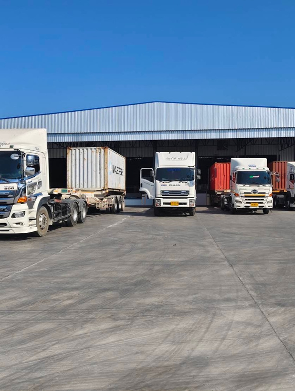 Logistics trucks at warehouse